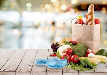 Christmas donation - food donations on light background, fresh vegetables, canned food,