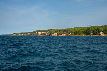 Fototapeta na wymiar Distant view of Pictured Rocks National Lakeshore from Lake Superior