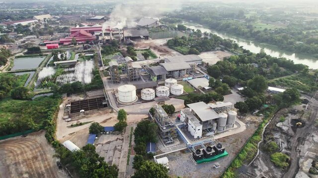 Modern bioethanol fuel products processing factory with tanks, warehouse and tower in southeast asia
