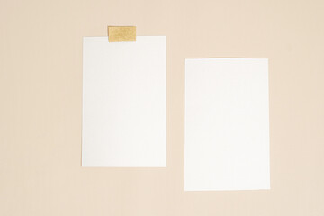 a closeup shot of the paper sheets posted on the wall. a layout composition for a copy space background with vintage room decoration concept. minimalist wall art mockup.