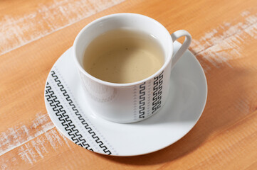 A cup of "espinheira santa" (Maytenus ilicifolia) tea, commonly prescribed for gastric problems.