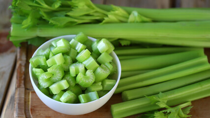 Chopped stalks of fresh celery in a bowl.