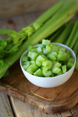Chopped stalks of fresh celery in a bowl.