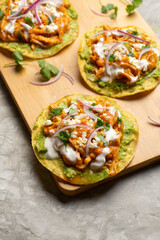 Chicken tinga tostadas with cheese and avocado. Mexican food