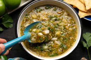Green hot sauce with jalapeno pepper. Mexican food