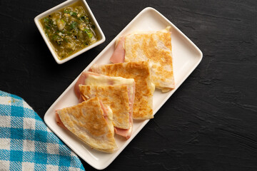 Ham and cheese quesadilla with flour tortilla. Mexican food