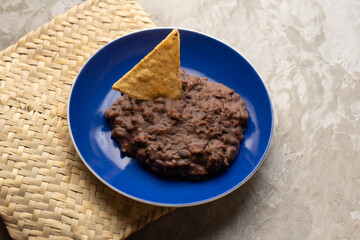 Refried beans on a gray background. Mexican food