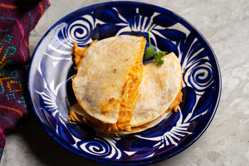 Chicken tinga quesadilla with flour tortilla. Mexican food