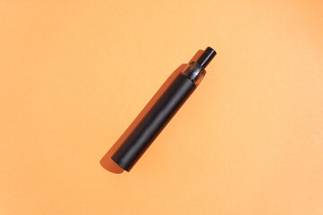 electronic cigarette on an orange background