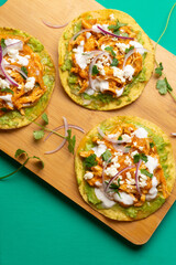 Chicken tinga tostadas with cheese and avocado. Mexican food