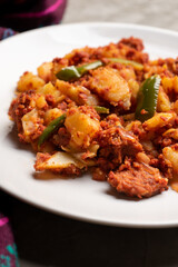 Potatoes with chorizo on a gray background.  Mexican food