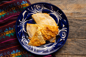Chicken tinga quesadilla with flour tortilla. Mexican food