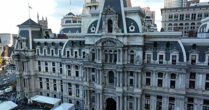 Rising aerial reveal of City Hall local government building in Philadelphia. Ornate architecture.