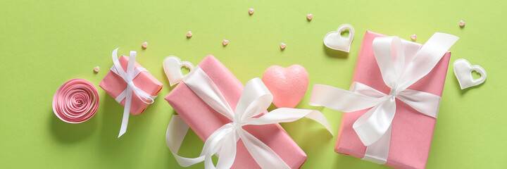 Presents for Valentines Day on green background with space for text