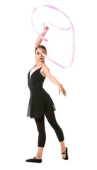 Beautiful young woman doing gymnastics with ribbon on white background