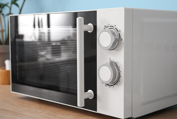 Fototapeta premium Modern microwave oven in kitchen, closeup