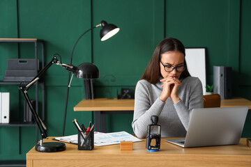 Female notary public working in office