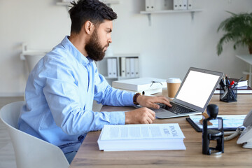 Male notary public working in office