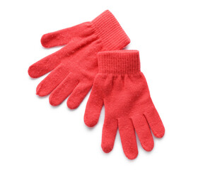 Pair of red gloves on white background