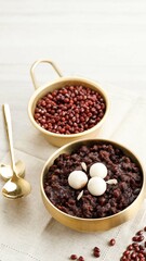 Korean Food Patjuk or Red Bean Porridge Topped with Round Rice Cake, Eat at Winter Solstice Festival