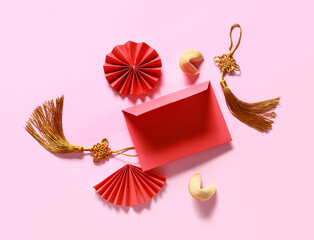 Red envelope with Chinese symbols on color background. New Year celebration