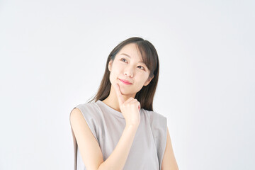 Fototapeta premium 女性 想像する 白背景