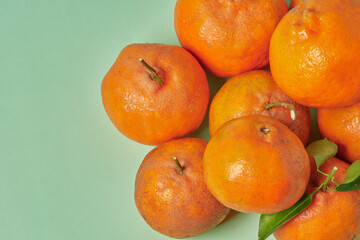 Tangerines on a green background.