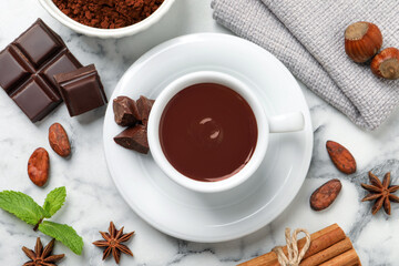 Flat lay composition with yummy hot chocolate on white marble table