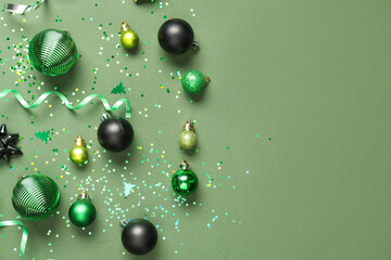 Beautiful Christmas composition with decor on green background