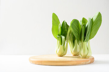 Bok choi (white cabbage) on a white background Ingredients in Asian Vegetarian and Healthy Food