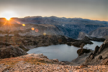 Naklejka premium Sunburst at the Twin Lakes in the Beartooth Mountain Range. 