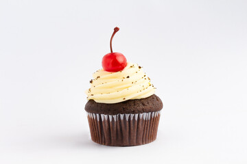 Muffin with topping and a cherry on top, isolated over a white background. With space for text.