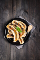 Pastry puff filling with bananas, cheese and chocolate shaped with banana molded or banana milk pastry. 