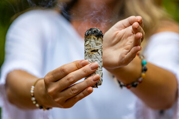 Close up of woman with burning Sage