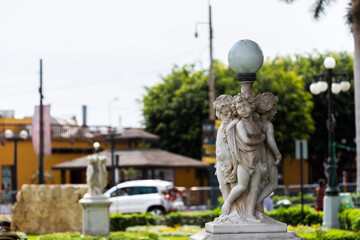 Fototapeta na wymiar BARRANCO, LIMA, PERU: Statue of children looking everywhere