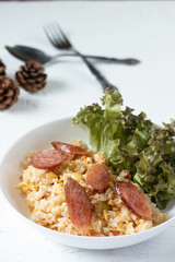 Fried rice with chinese sausage(Kun Chiang fried rice) in a white plate
