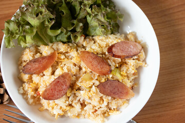 Fried rice with chinese sausage(Kun Chiang fried rice) in a white plate