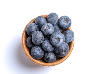 fresh blueberries in a wooden cup