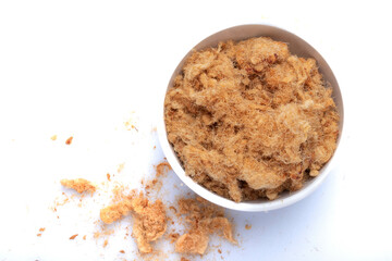 dried shredded pork in a white ceramic cup