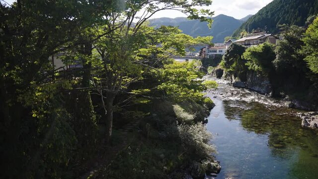 Late afternoon sun on warm day in Gujo Hachiman, Gifu Japan. Yoshida River