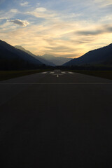 Vertical shot of an empty asphalt road in Goms region in the Kanton Wallis in Switzerland