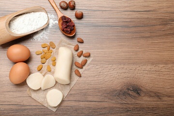 Ingredients for homemade Stollen on wooden table, flat lay. Baking traditional German Christmas bread