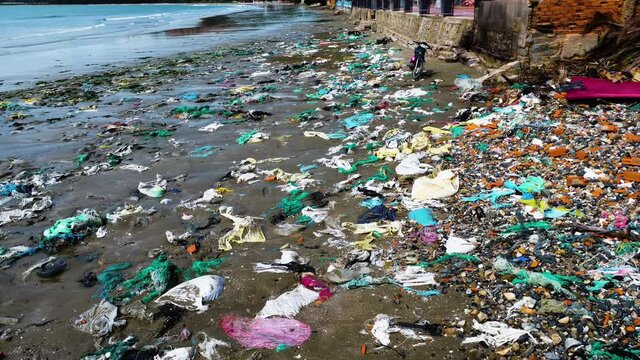Hon Rom beach in Mui Ne, Vietnam. Plastic pollution and waste cover the shore