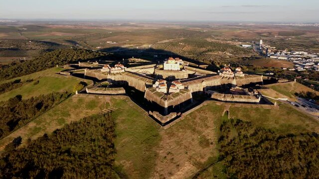 Aerial shot of Nossa Senhora da Graca fort in Elvas. Total shot flying around the fort during the golden hour. Portugal in Europe