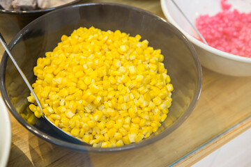 Steamed sweet corn in big bowl, Thai style sweet ingredient, cooked corn