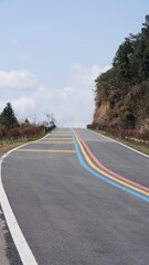 The beautiful country road cross the mountains and village in the countryside of the China