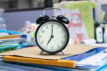 clock on work desk in the office Time of businessman working concepts