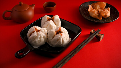Steamed red minced pork buns, fried shrimp dumplings. Chinese appetiser