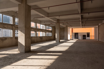 Unfinished concrete warehouse interior space passage