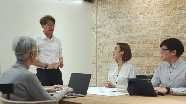 Executive leader train professional team at business seminar